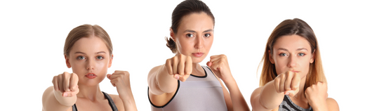 three women with arms up